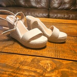 Cream colored open toe wedge sandals
